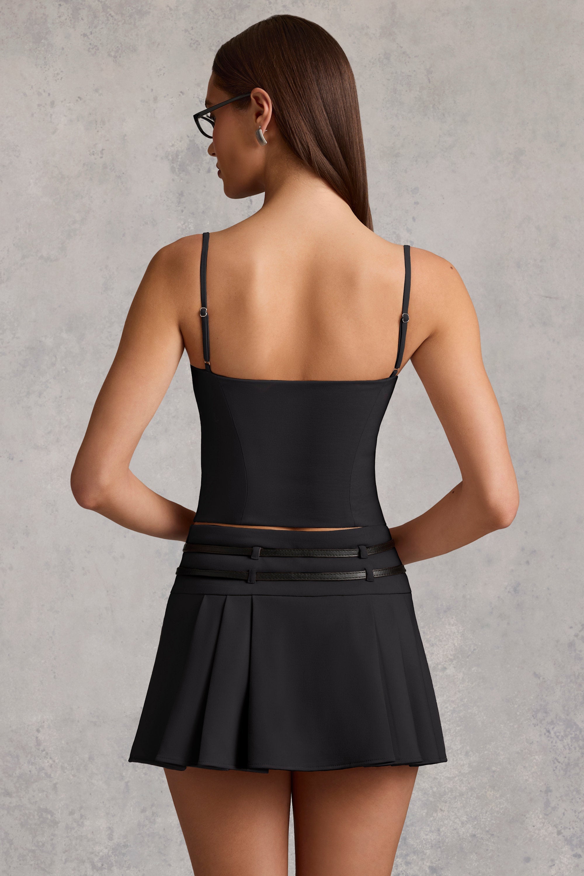 Belted Low-Rise Pleated Mini Skirt in Black