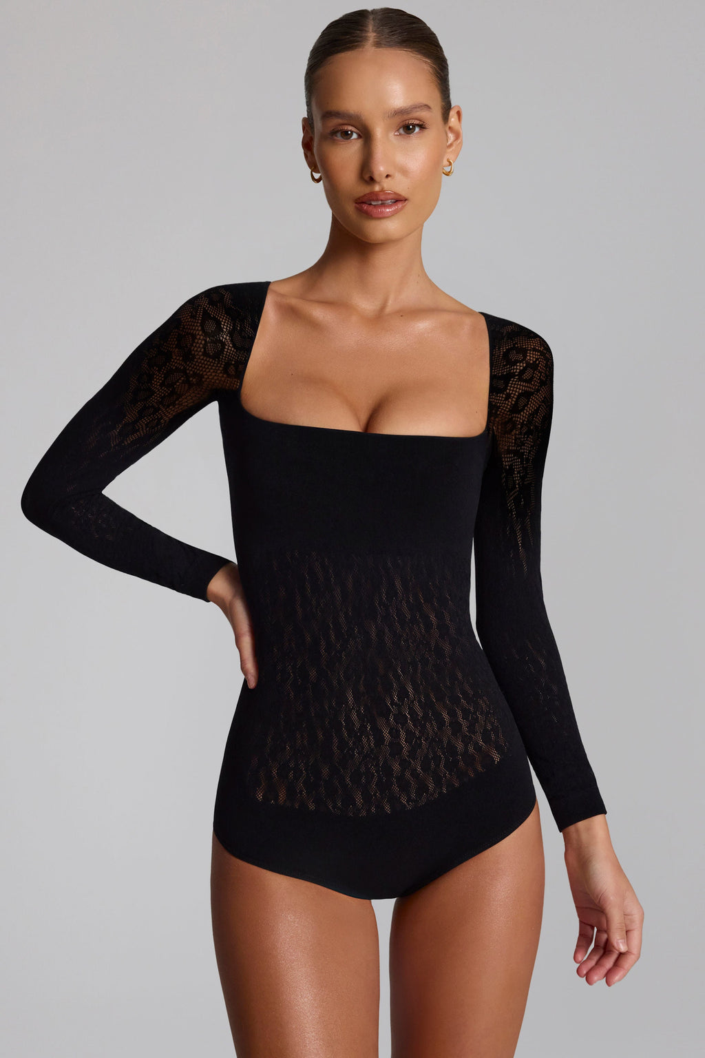 Cap-Sleeve Seamless Knit Bodysuit in Black