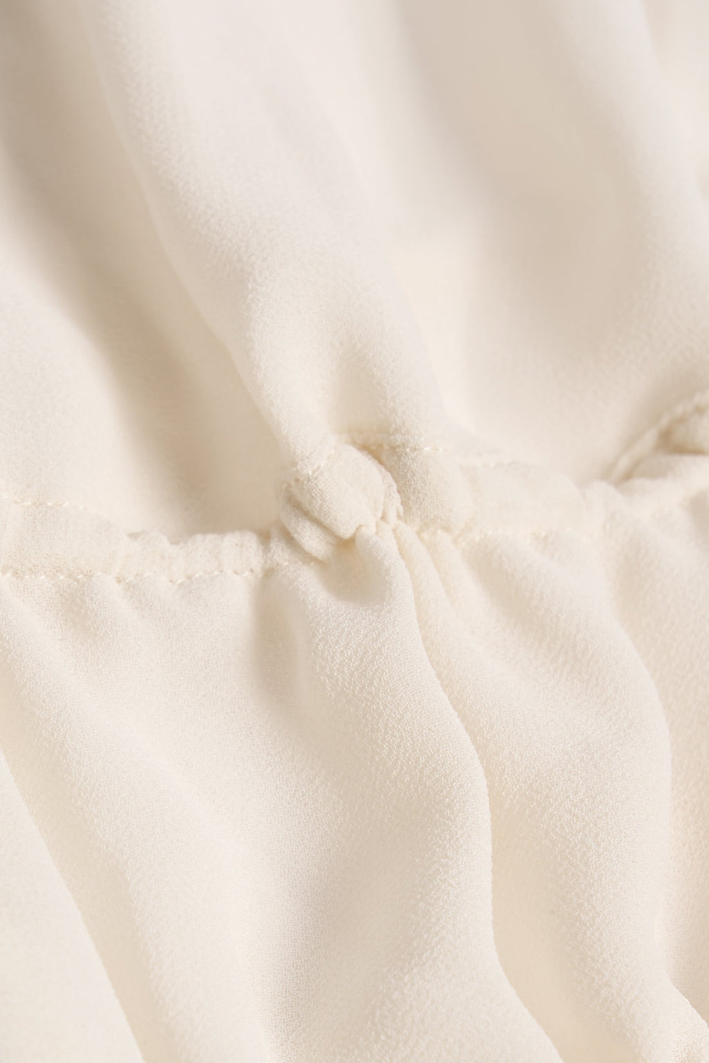 Cut-Out Semi-Sheer Ruched Halterneck Crop Top in Ivory