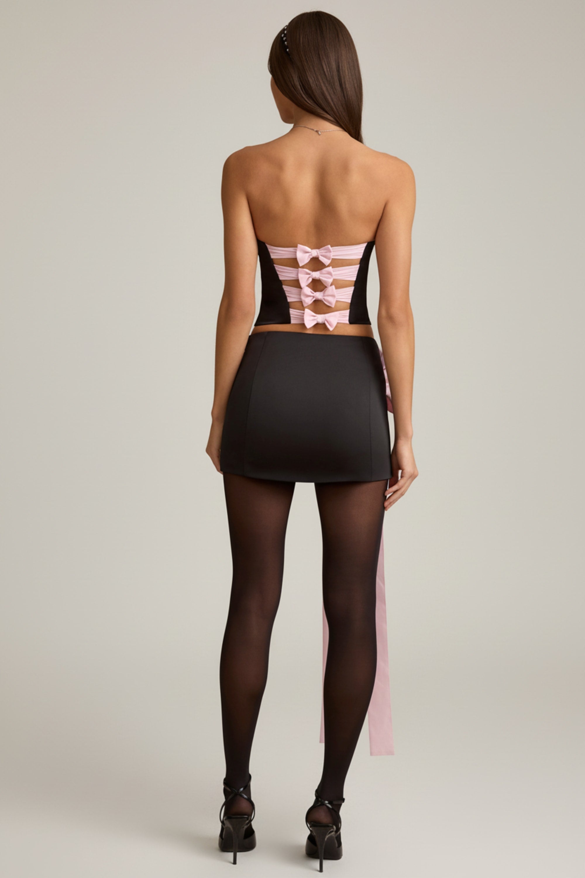 Bow-Detail Low-Rise Mini Skirt in Black