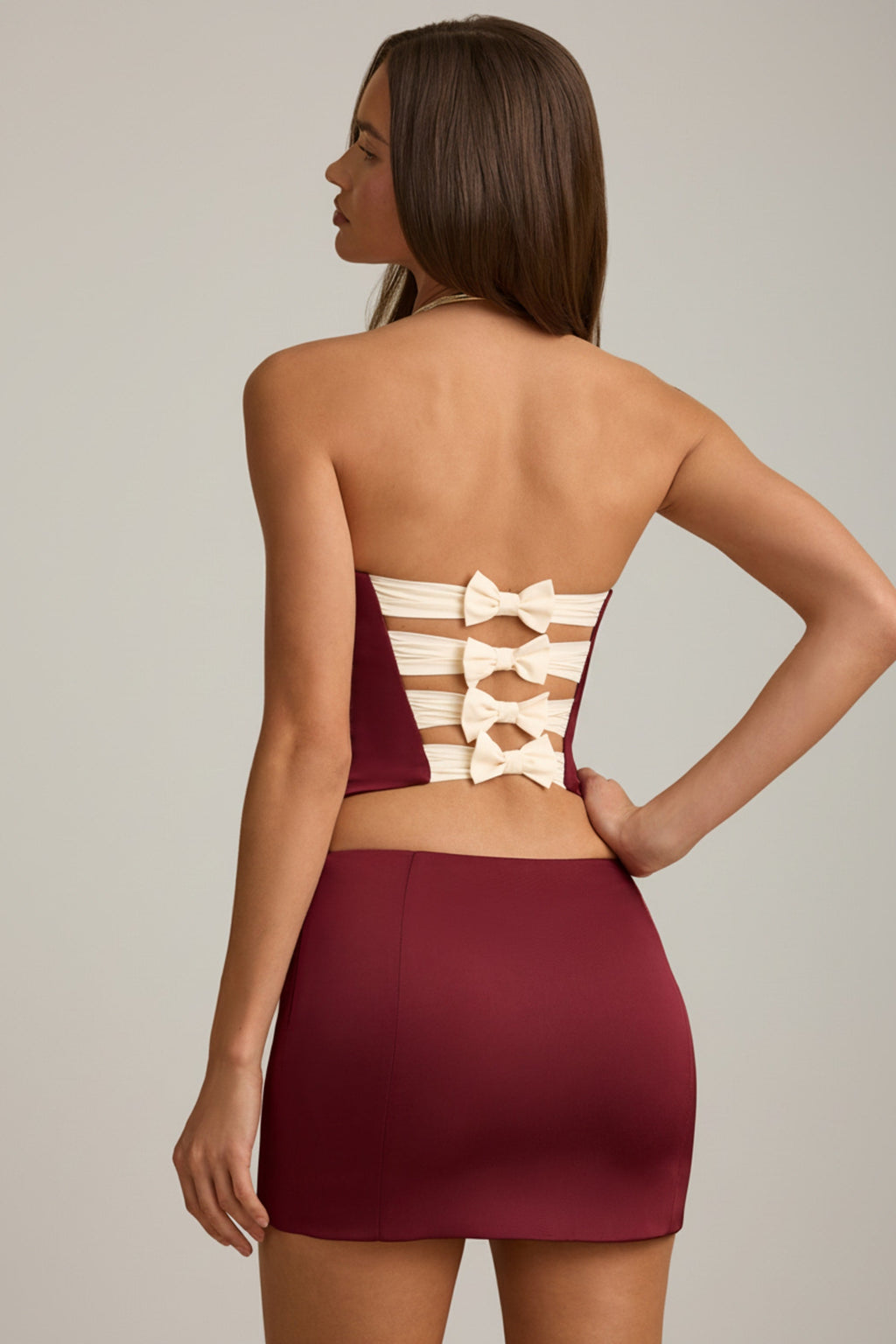 Bow-Detail Low-Rise Mini Skirt in Wine Red