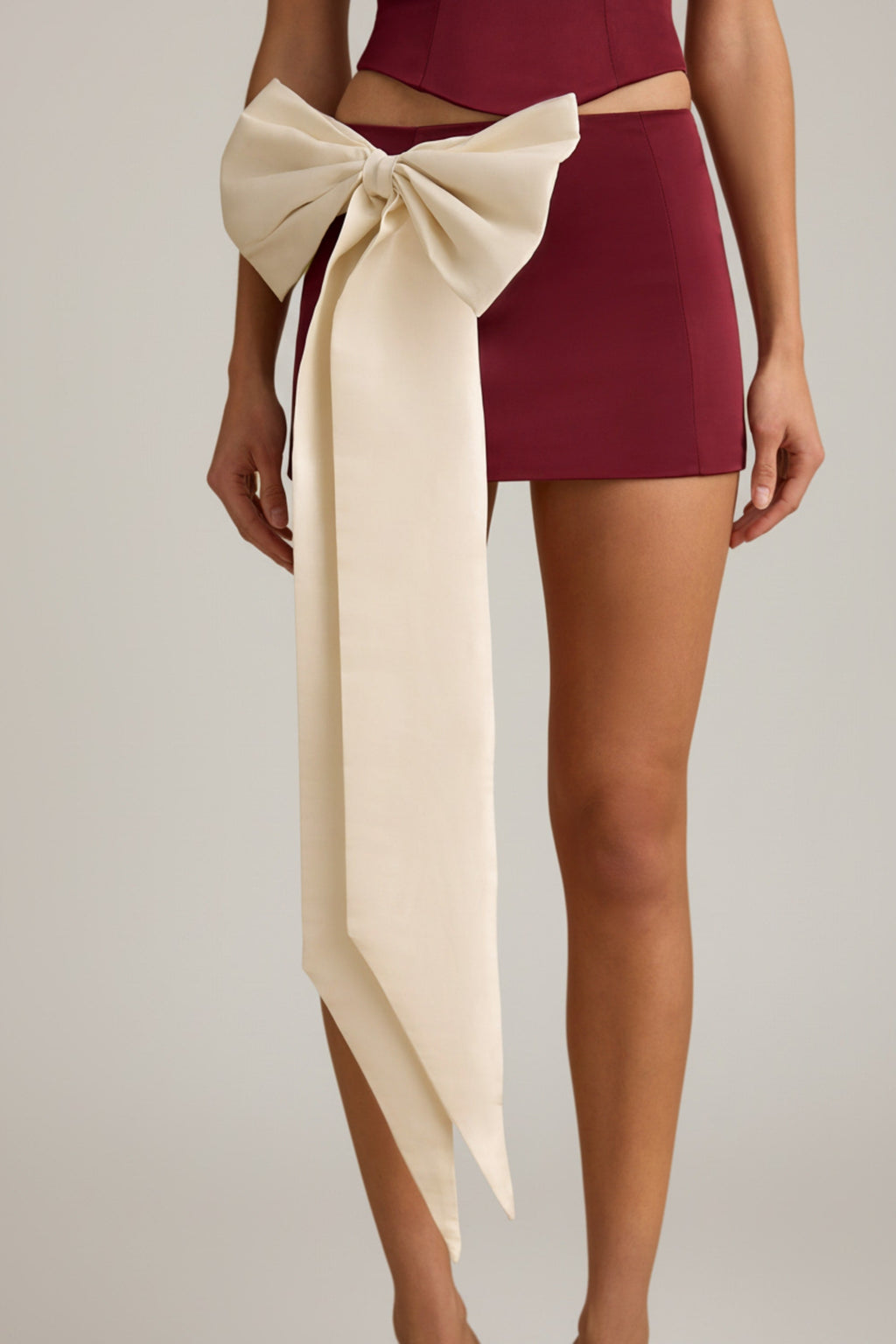 Bow-Detail Low-Rise Mini Skirt in Wine Red